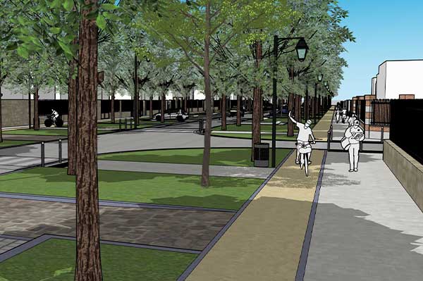Vue d'un boulevard à Soissons, montrant une large allée bordée d'arbres et de lampadaires. Des personnes se promènent et font du vélo sur un chemin pavé. Des espaces verts avec de l'herbe et des zones de repos sont visibles de part et d'autre du boulevar